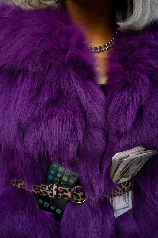 a close up of a woman in purple fur coat