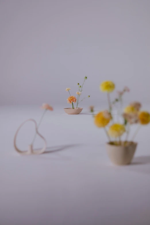 the tiny flowers are in the vase, the stems appear to have tiny flowers in them