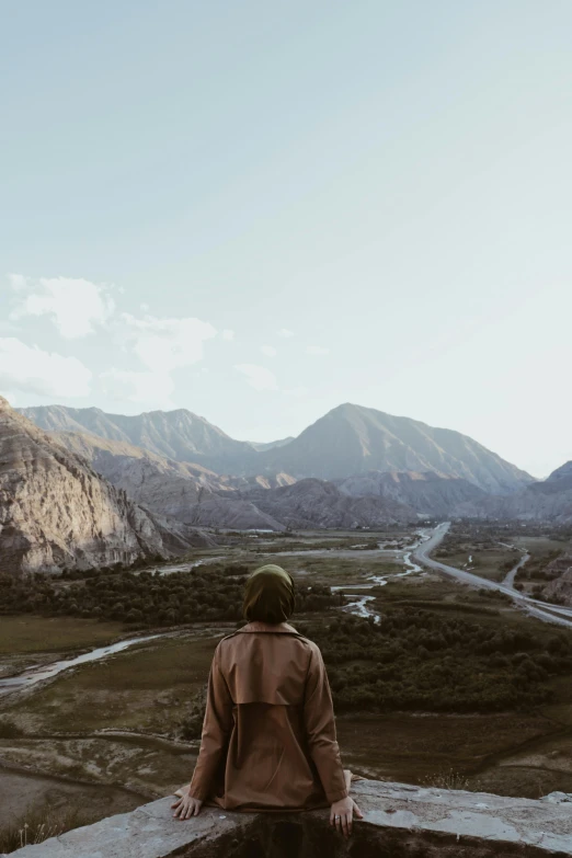 a person looking out over a vast valley