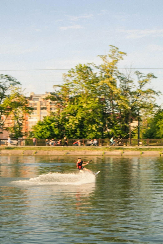 a man riding skis while being towed by a boat