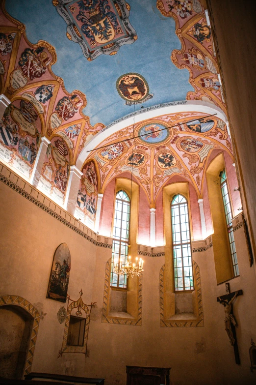 the ceiling of an old church with paintings on it