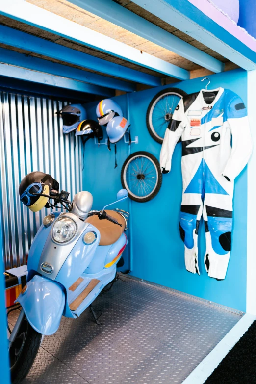 a motorcycle and a surfboard in a storage room