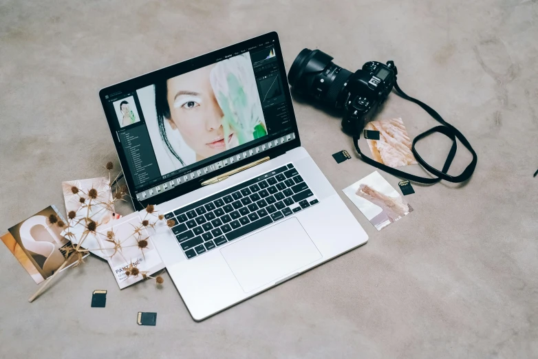 a laptop on a floor with an open camera