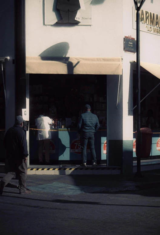 a couple of people standing at a doorway