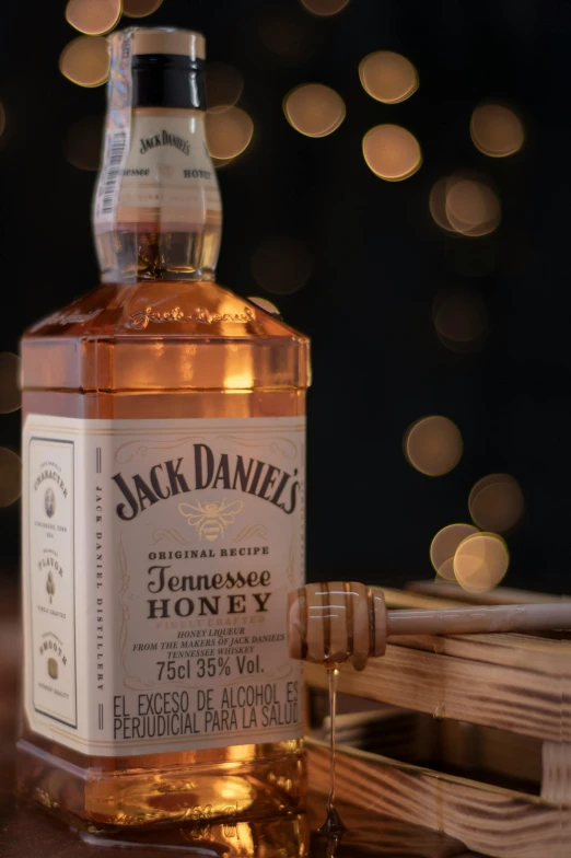 a bottle of jack daniels honey in front of a blurred background