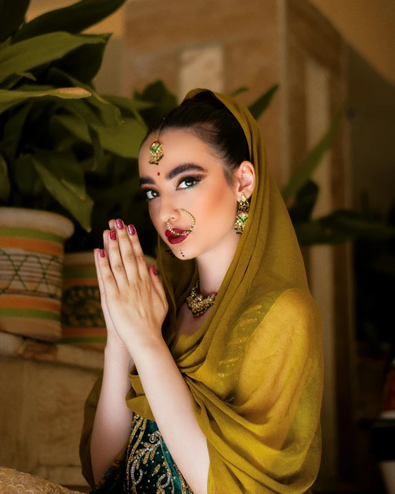 a girl with her hands folded in prayer