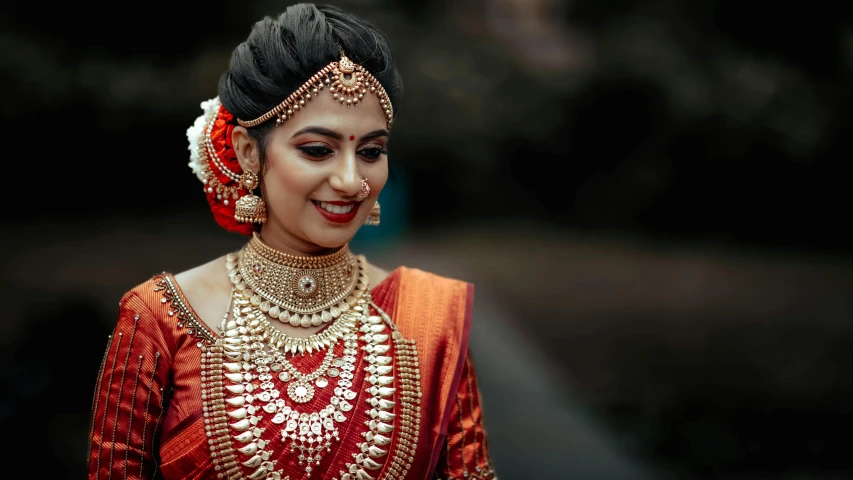 a woman wearing an orange and red outfit