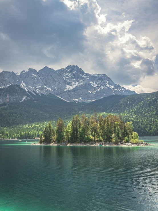 a lake with mountains in the distance