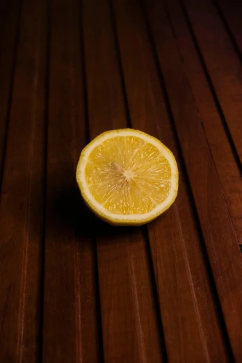 an orange that is sliced into pieces on a table