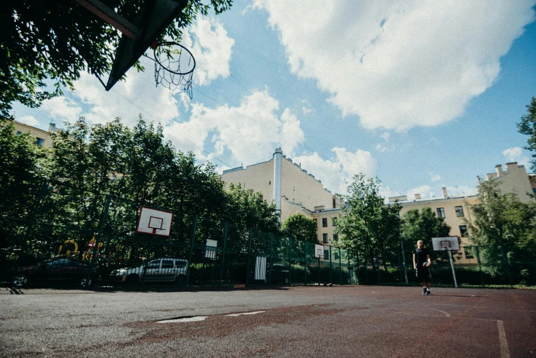 a person is playing basketball in the street