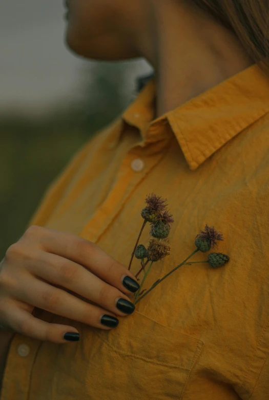 a person with a flower on their hand