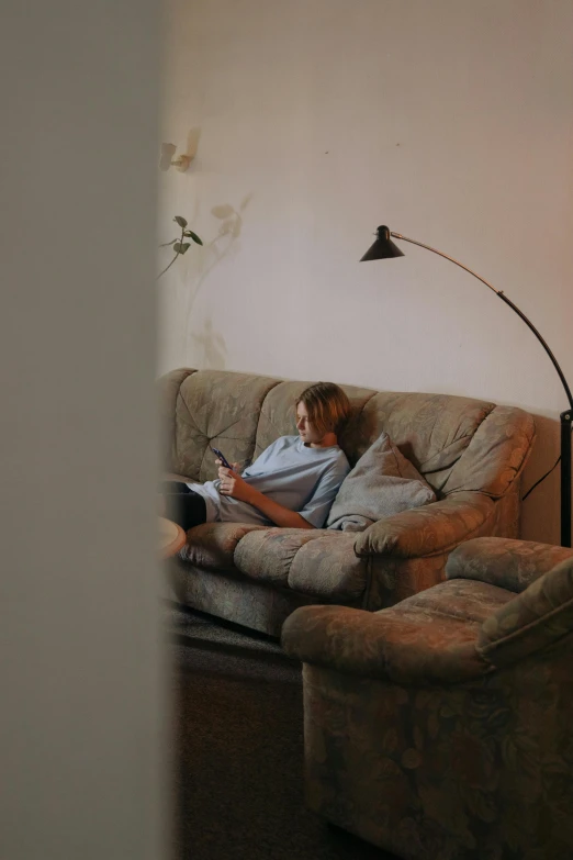 a person is on the couch and reading