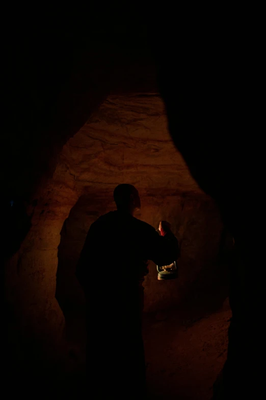 a person holding soing lit in the dark