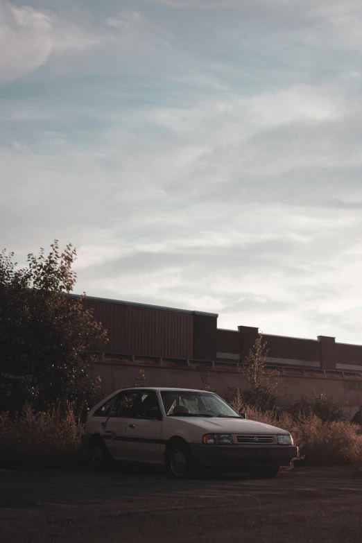 the car is parked along side the building