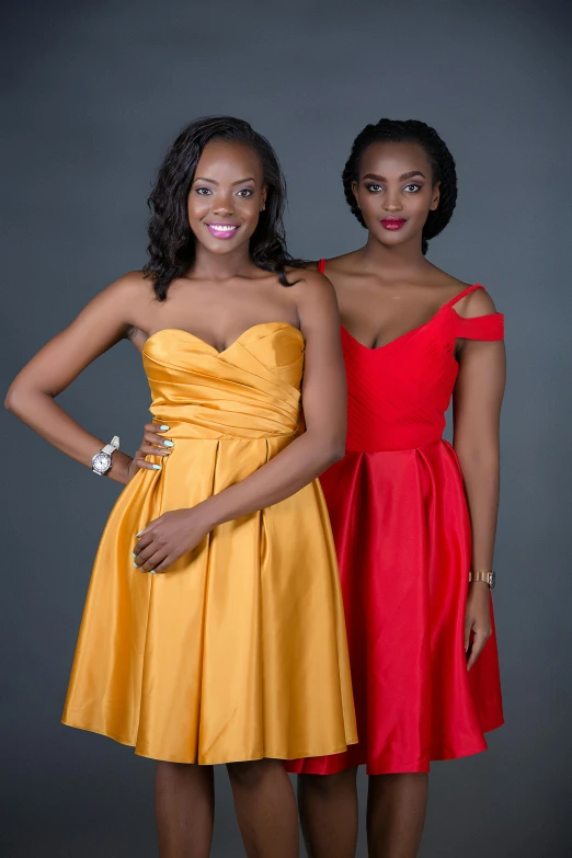 two beautiful young women standing next to each other