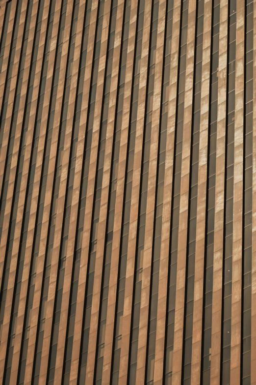 a bird sitting on a stone building ledge