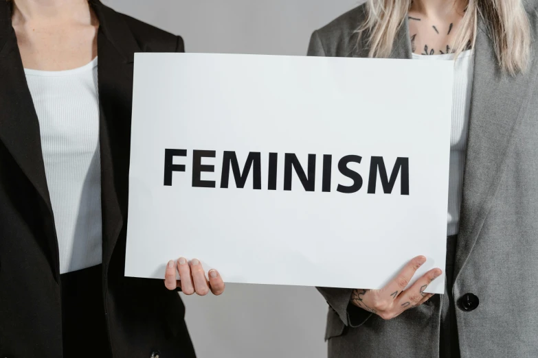 two women holding up an affa sign