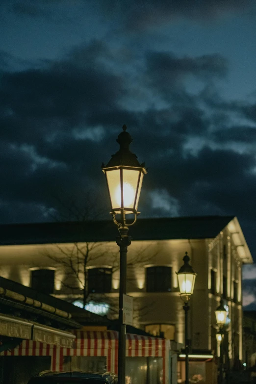 a lamp post lit by a street light