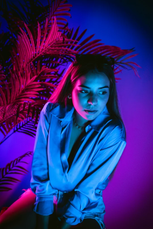 the young woman poses for a portrait in a purple and pink po