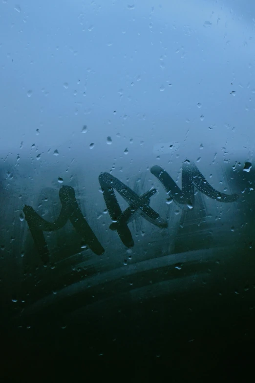 an airplane is flying down a rainy, dark and stormy day