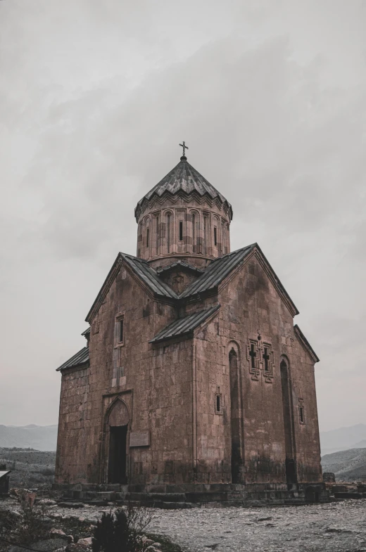 an old stone church is standing alone