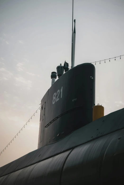 a small submarine in the ocean at dusk