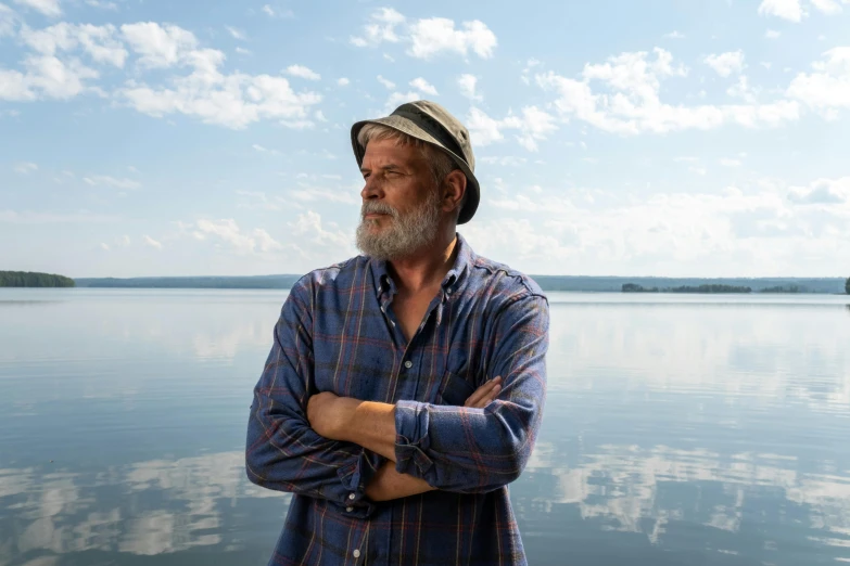 a man with a beard and wearing a hat