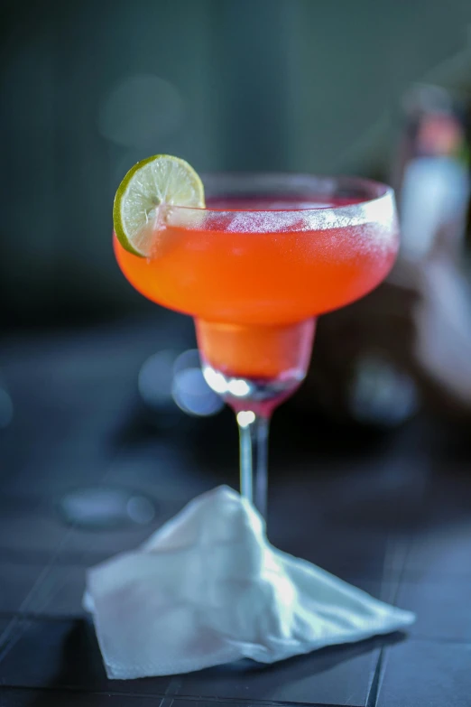 an orange alcoholic drink is on the table