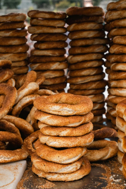 stacks of bagels sitting on top of a table