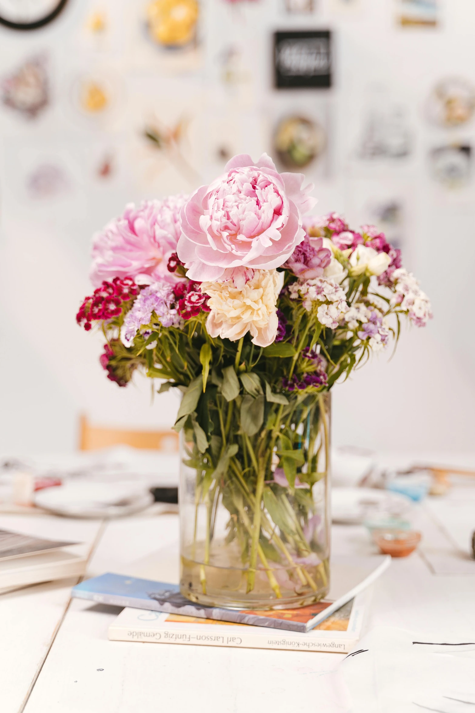 a bunch of different flowers are in a vase