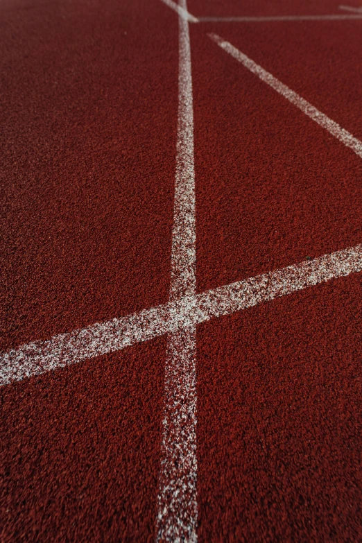 an outdoor tennis court with white lines