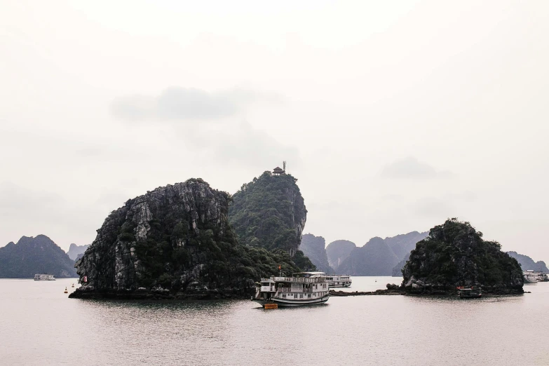 a group of boats floating on top of a body of water