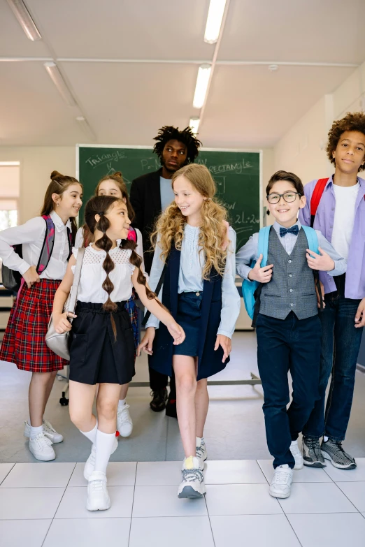 children walk away from the class with their teacher