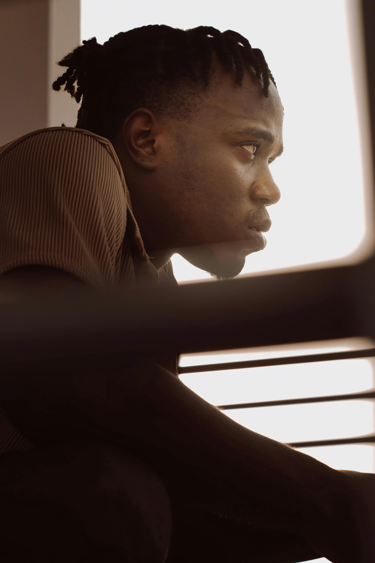 an image of a man sitting next to his laptop