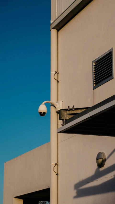 an outdoor street light near a building