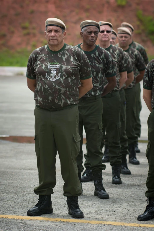 a group of men standing in formation outside