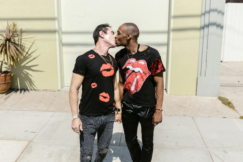 two young people standing next to each other with their mouths open