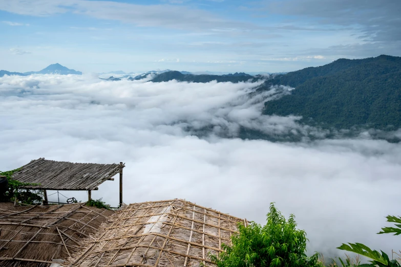 a hut with no roof above the clouds