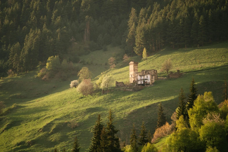 old house abandoned on a hill side in a valley