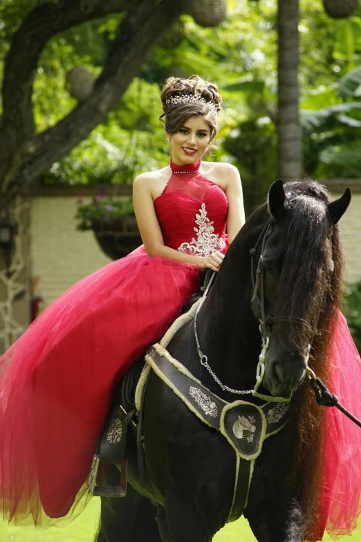  dressed in a red dress and riding horse