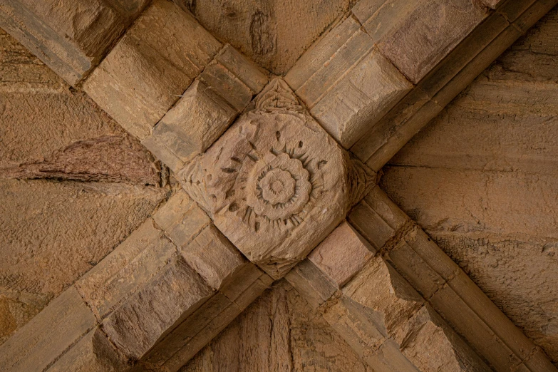 stone designs on the outside wall of a brick building