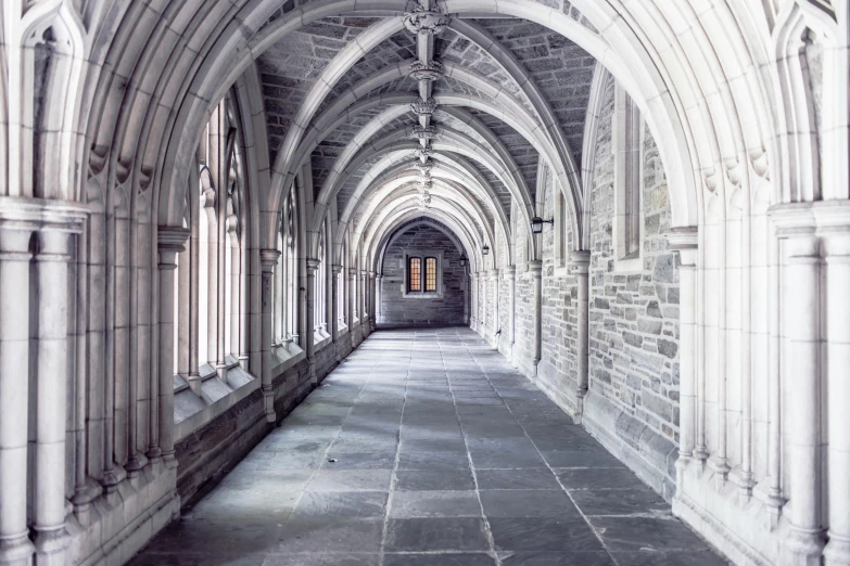 a view of an empty hallway with arched windows