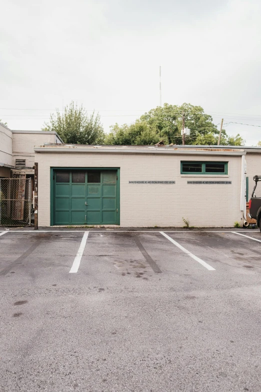 two cars are parked next to a garage