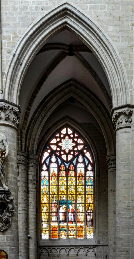 an arched window inside of a church