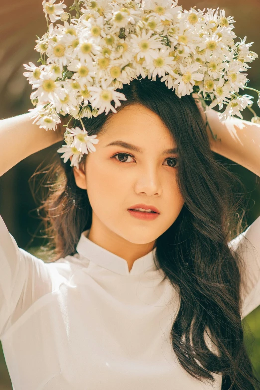 a girl is posing for the camera wearing flowers in her hair