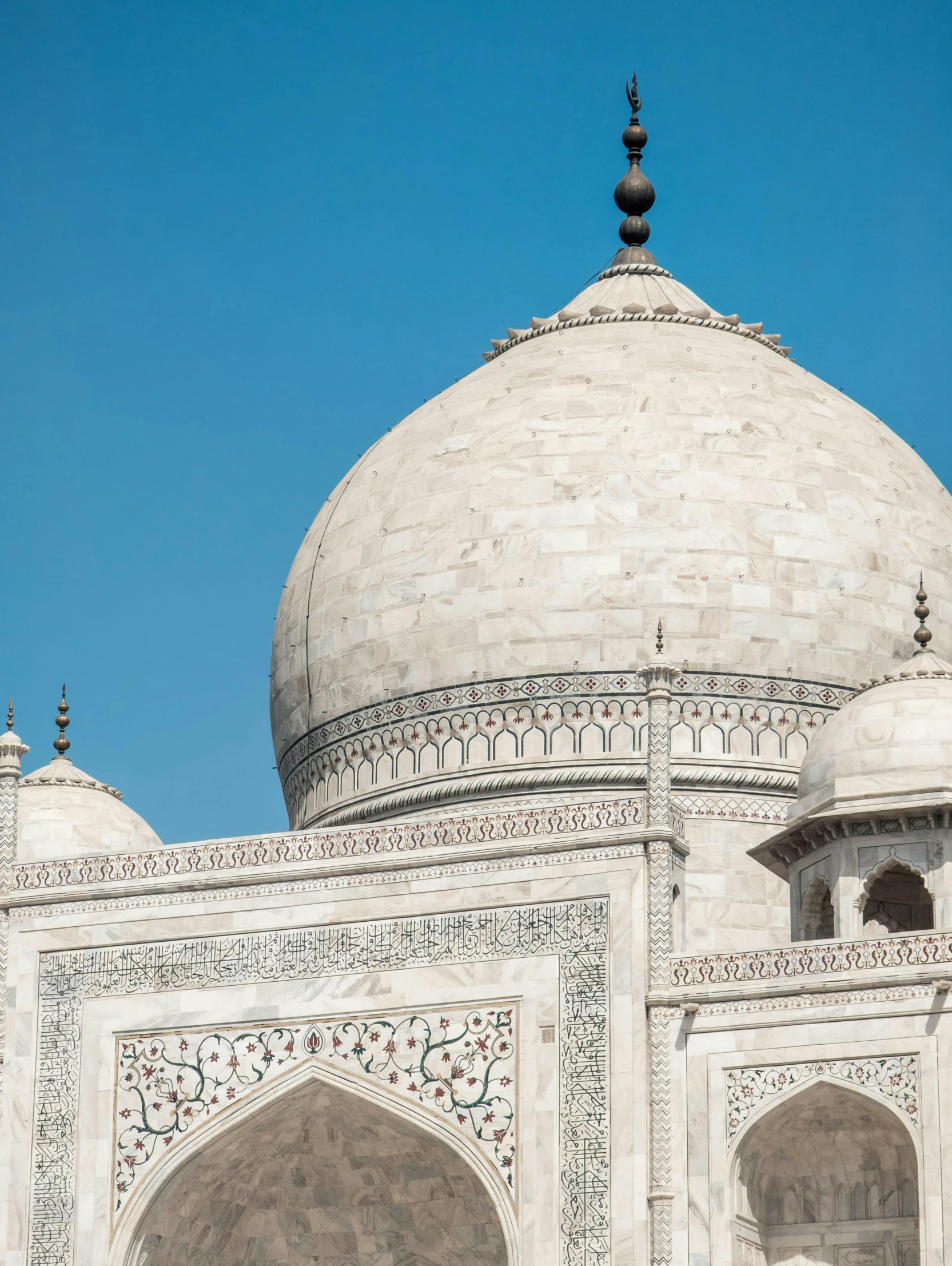 an intricate white building on a sunny day