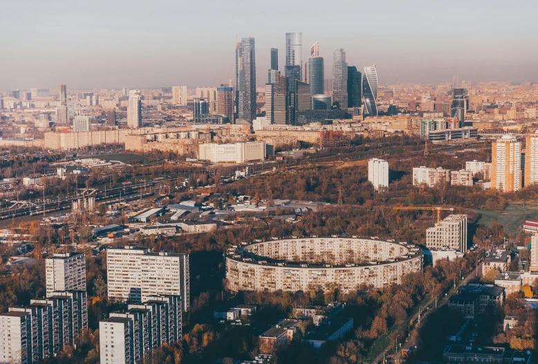 a large city with buildings and trees in front of it