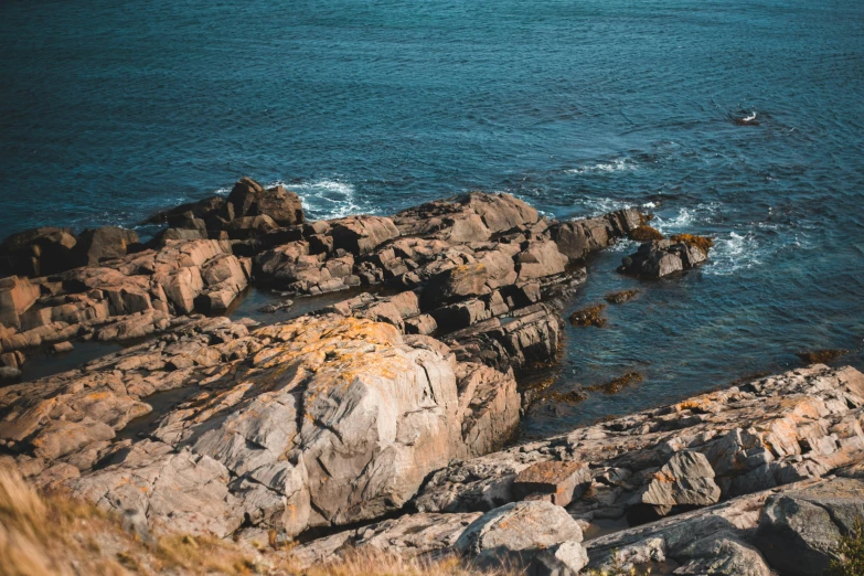 the ocean is seen from above some rocks