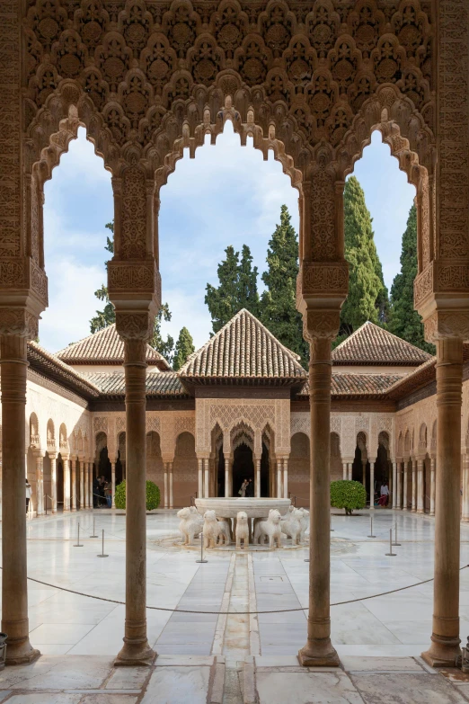 a courtyard of some sort surrounded by many columns and pillars