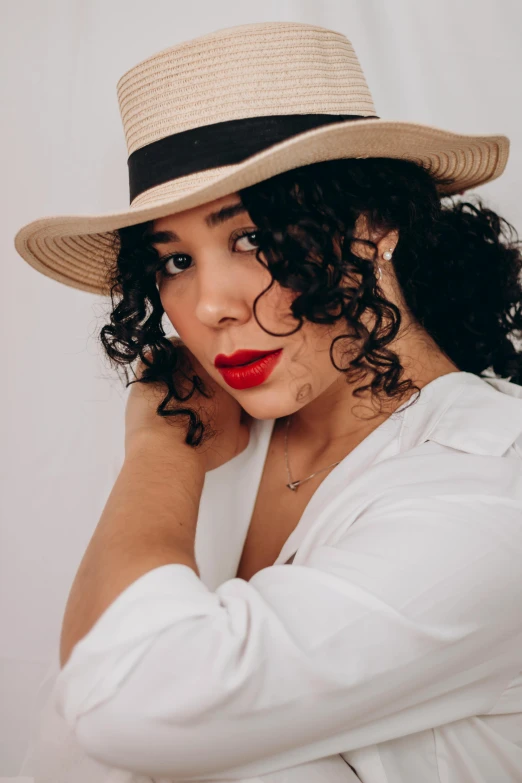 a close up of a woman wearing a hat